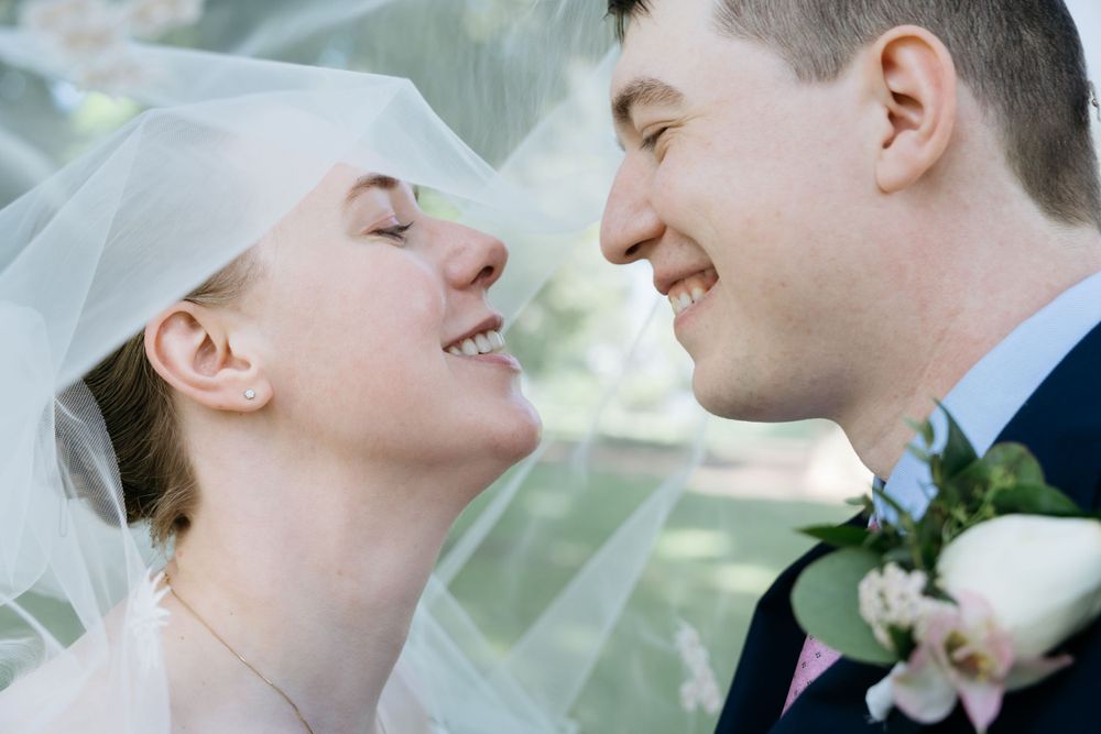 Outdoor elopement photography session with couples under veil wearing near Charlottesville, Virginia
