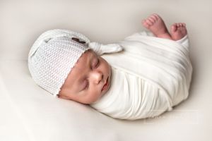 newborn swaddled sleeping portrait