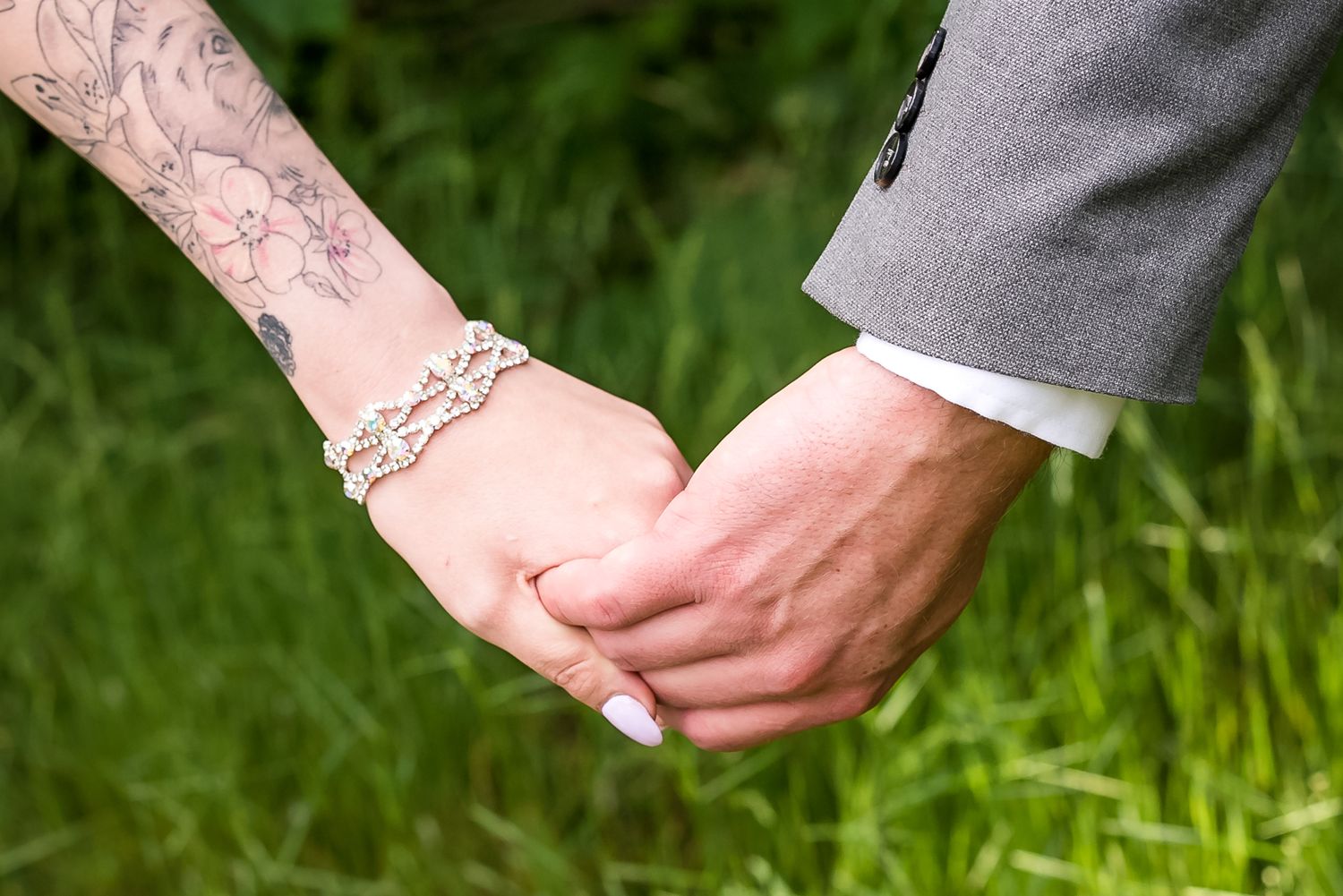 Bride and groom holding hands before first look at Hope Golf Club. Photo taken by Kari Mills Photography in Hope, B.C.