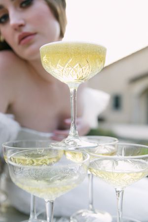 A stacked champagne tower at a wedding celebration.