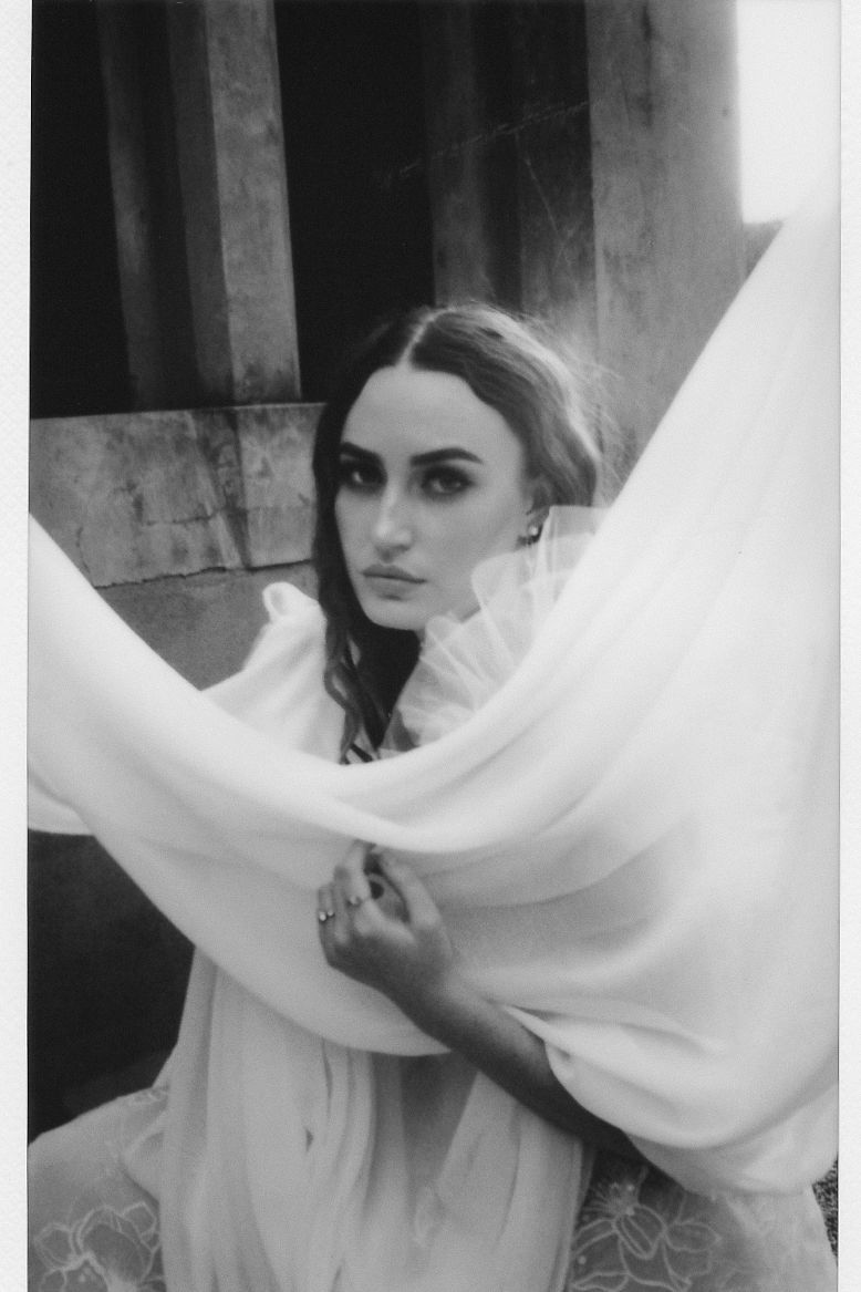 A bridal portrait taken on expired monochrome Instax wide film.