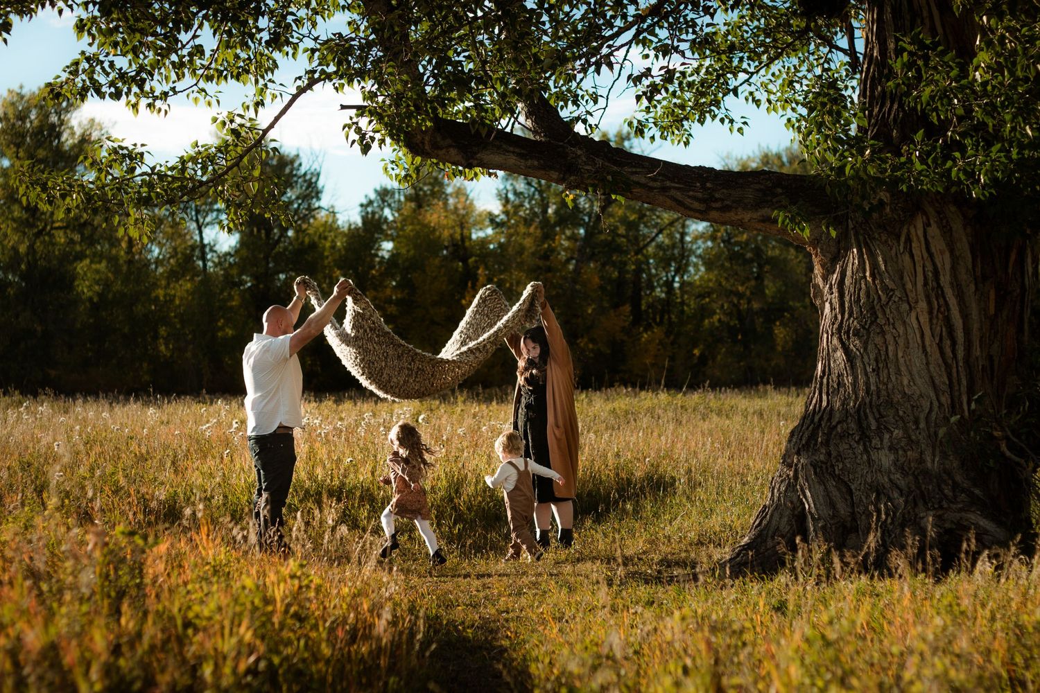 Beautiful golden hour family photography in Calgary's Fish Creek Park.