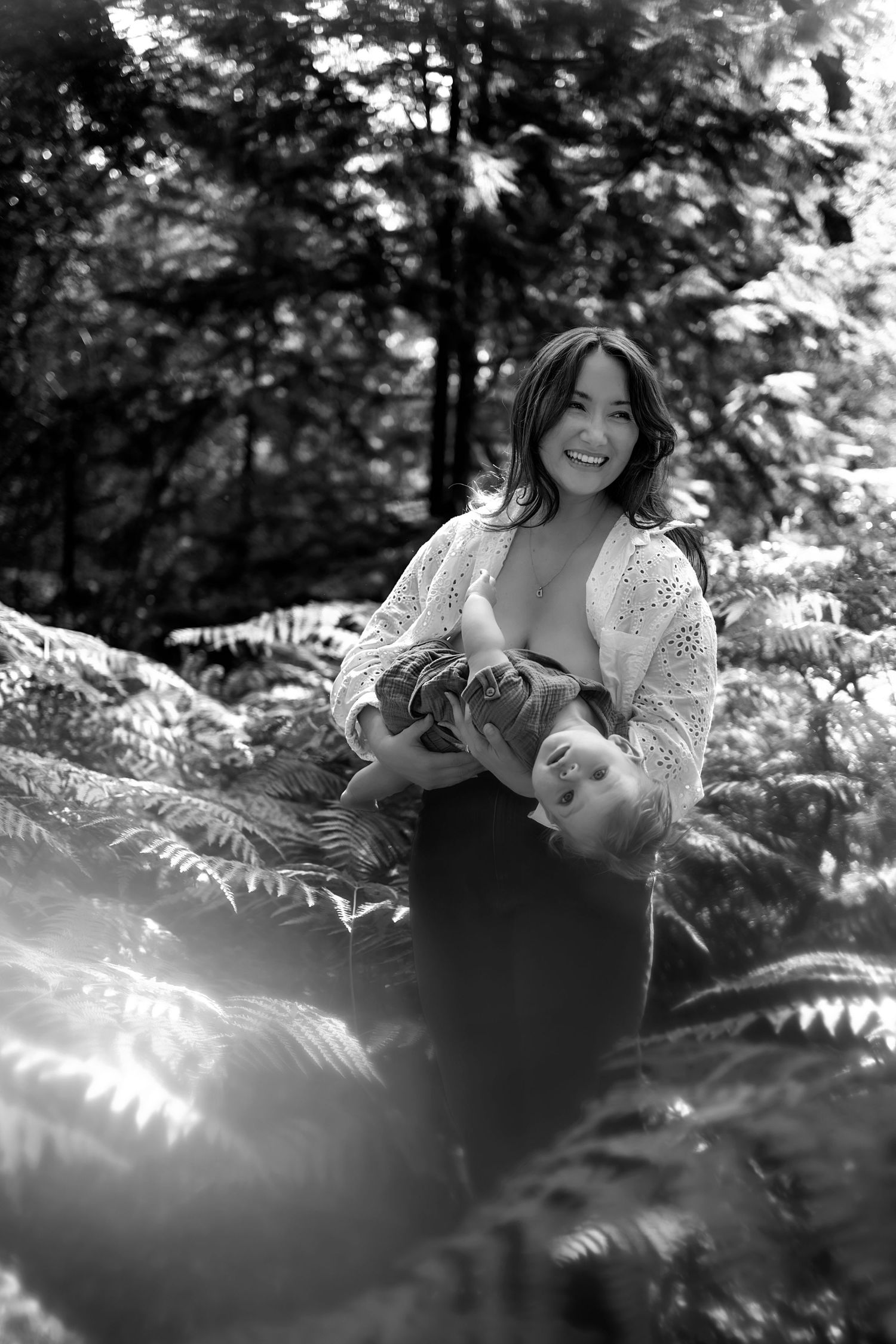 Mother and baby playing during an outdoor photo session in Rhinefield Forest, New Forest.