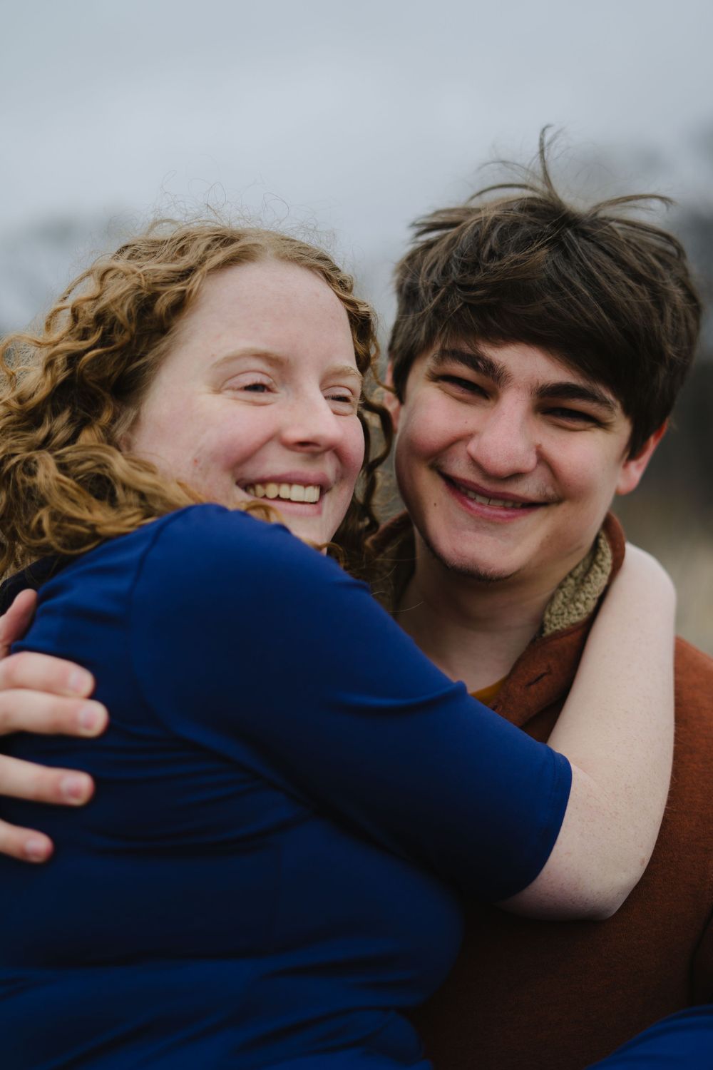 jake holding emily and spinning her - couple photography in madison wisconsin