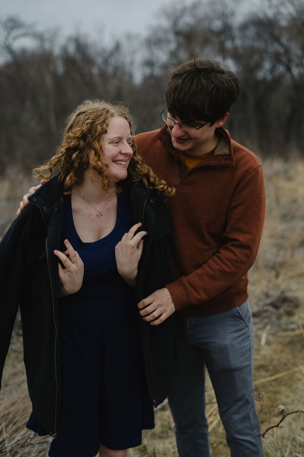 jake putting his jacket over emily's shoulders - couple photography in madison wisconsin