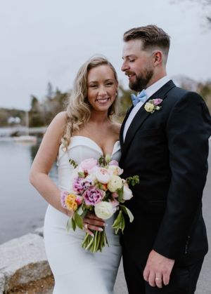 Bride and groom photos in front of Dingle Tower at Sir Sanford Fleming Park in Halifax Nova Scotia