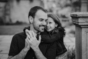 A father and daughter share an adorable, intimate moment