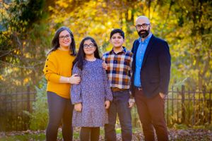 ambient lighting accentuates a family. Fall colors highlight this picture