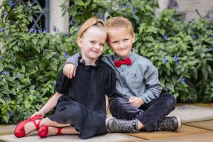 These twins are classically dressed in eye popping black and red attire
