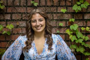 vibrant vines frame this young girl's perfect face captivating and flawless
