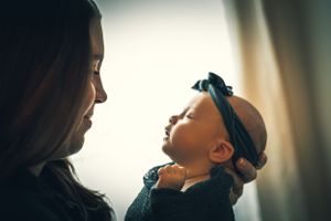 Mother gazes lovingly at her baby