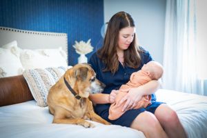 A cozy family photo with a newborn baby
