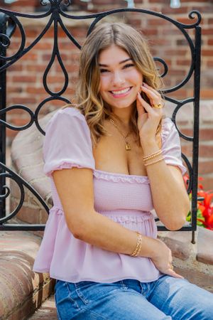 Vibrant colors in a senior portrait of a gorgeous girl smiling