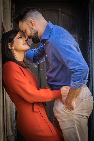 A passionate moment caught between an engaged couple