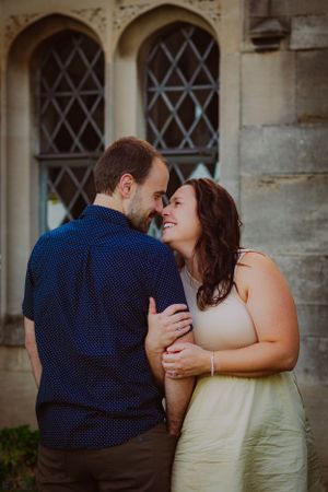 A husband and wife share an adorable, intimate moment