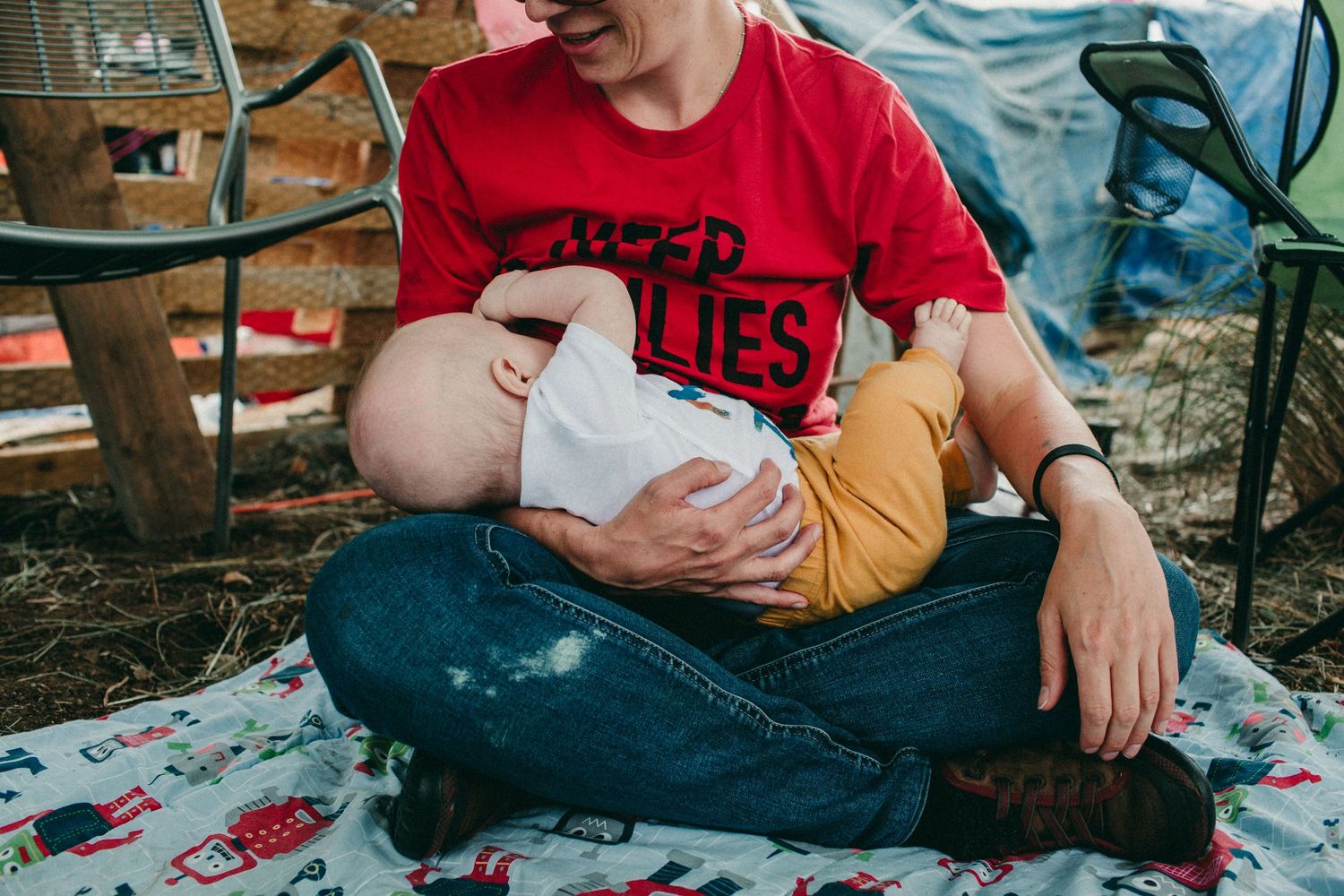 parent chestfeeds baby on police line outside ICE detention center Portland OR photojournalist