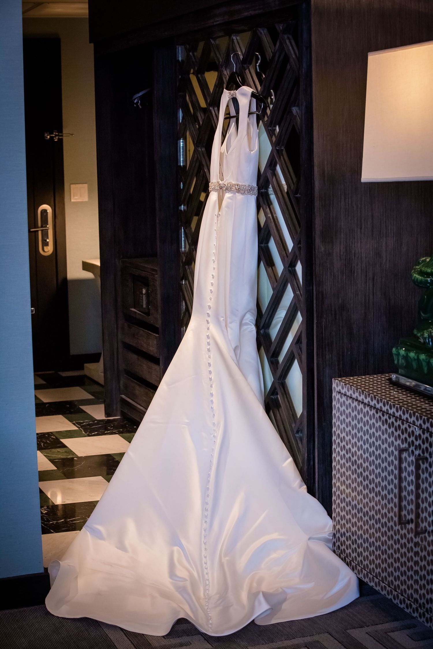 Series of elegant white wedding dress details showing flowing train and fabric in dramatic lighting.