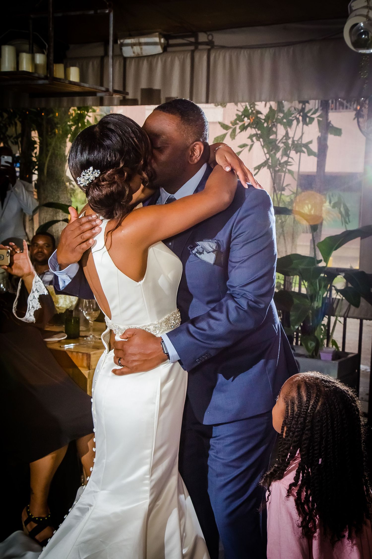 Couple sharing a romantic dance moment at their wedding reception.