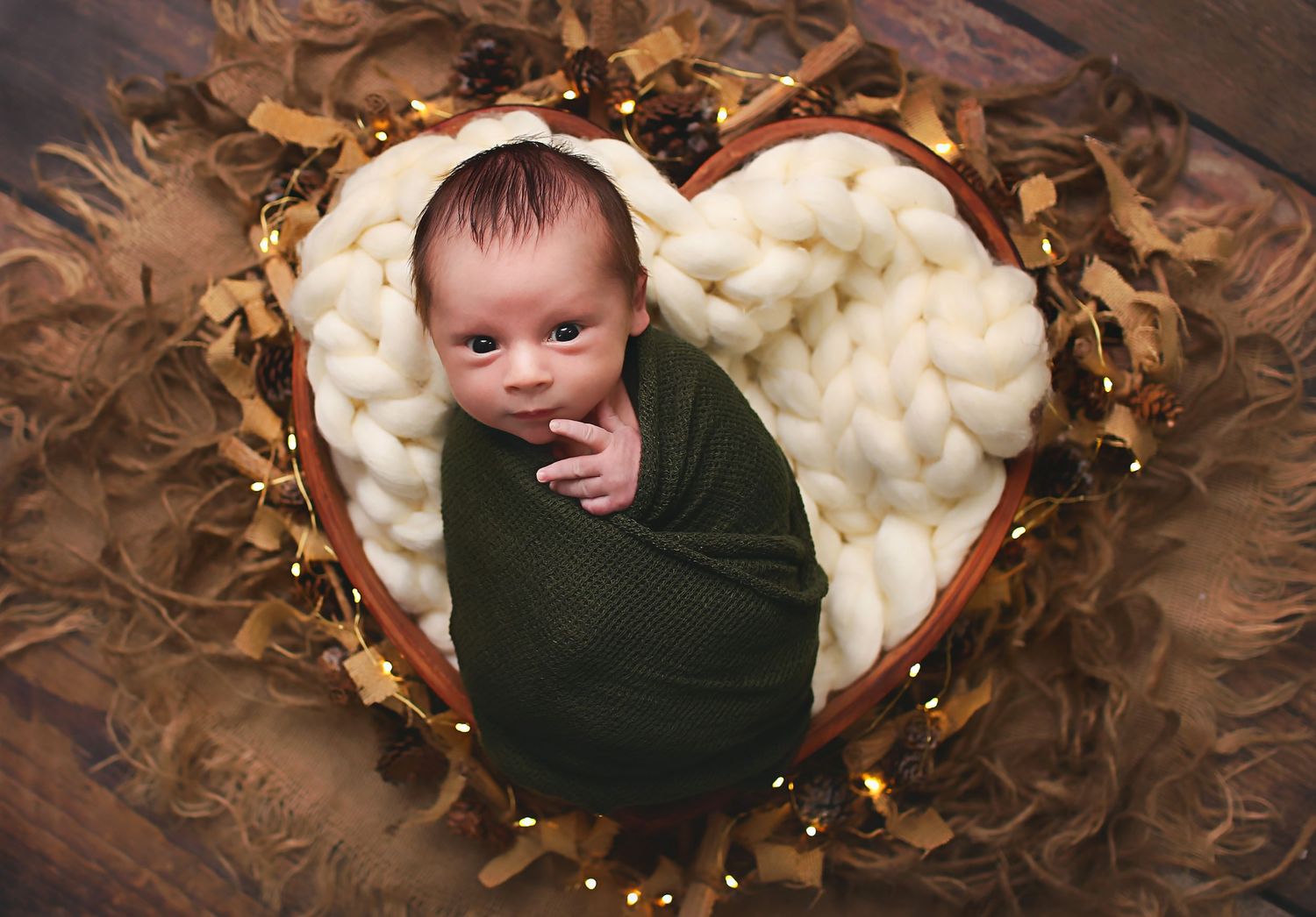 Baby wrapped in Heart shaped bowl in Alvin, Tx photography studio