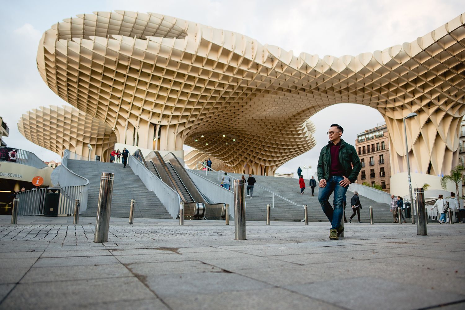 Modern waffle-pattern wooden architectural structure creating geometric shadows.