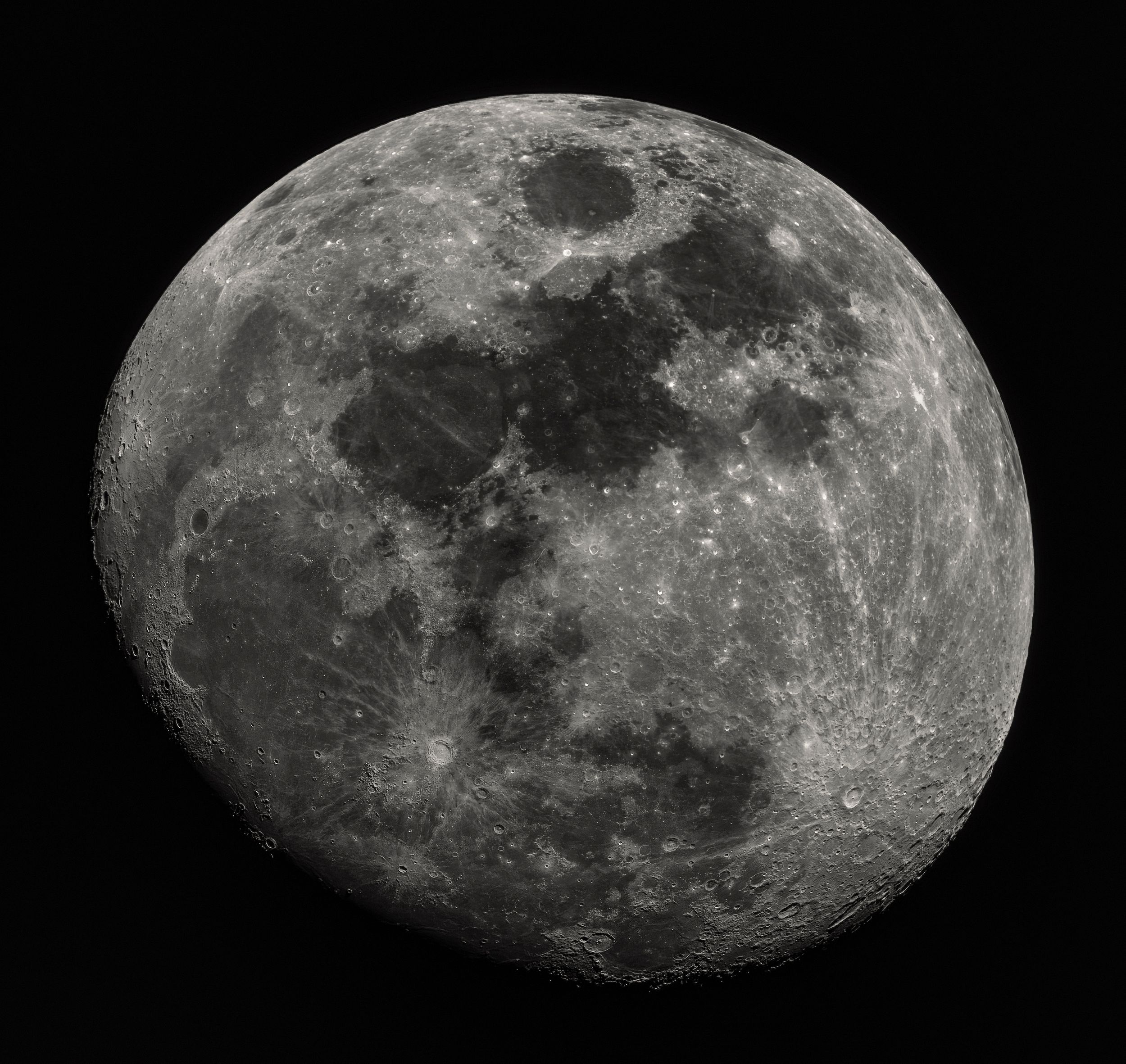 A waning gibbous moon showing detailed surface features and craters in grayscale.