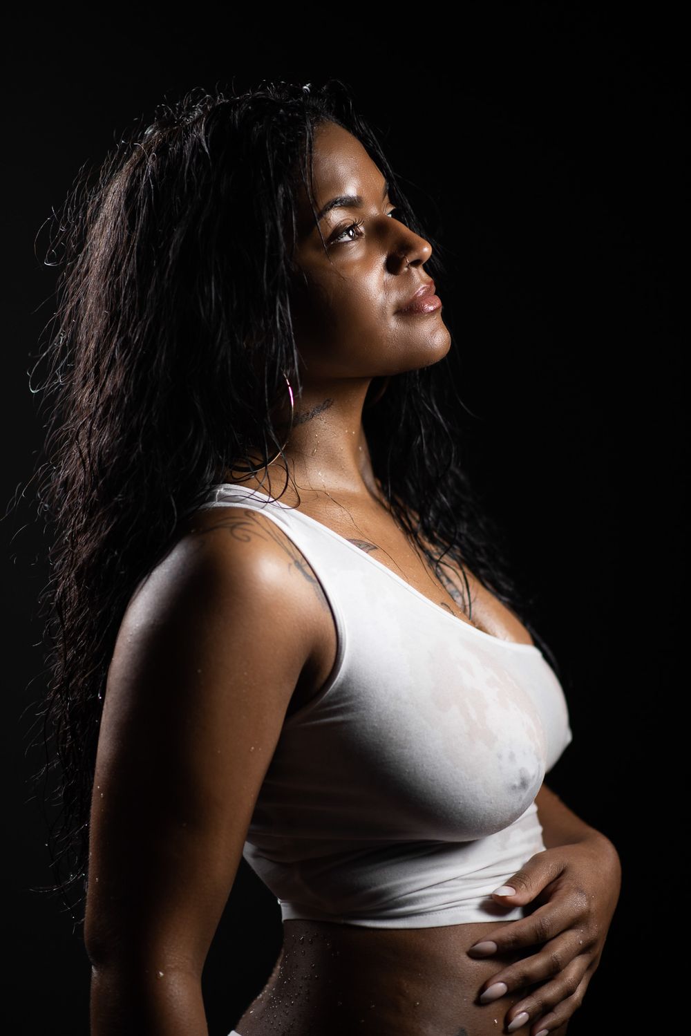 Sexy boudoir photography session in Buffalo, NY. Wet female portrait session.