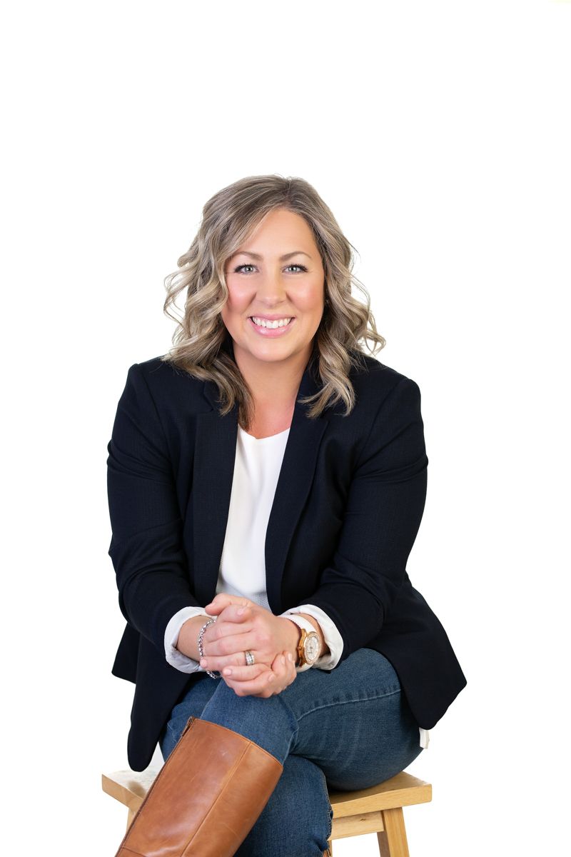 A business headshot portrait of a realtor on a white background