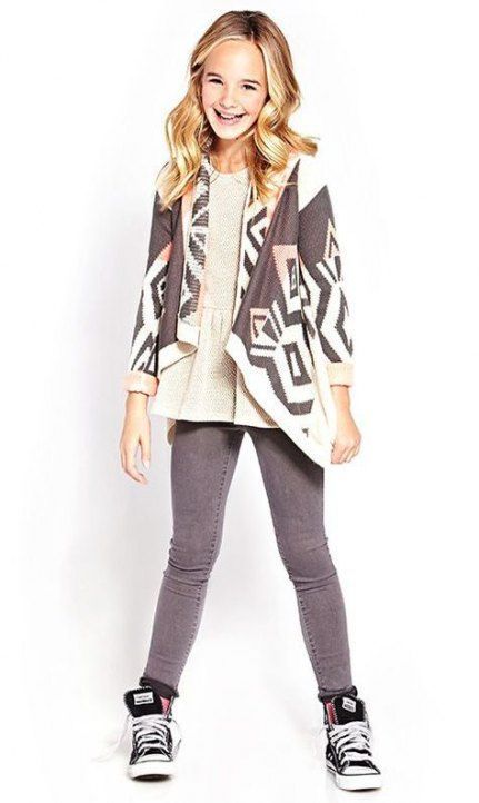 Stylish youth wearing geometric pattern cardigan with gray leggings and black Converse sneakers.