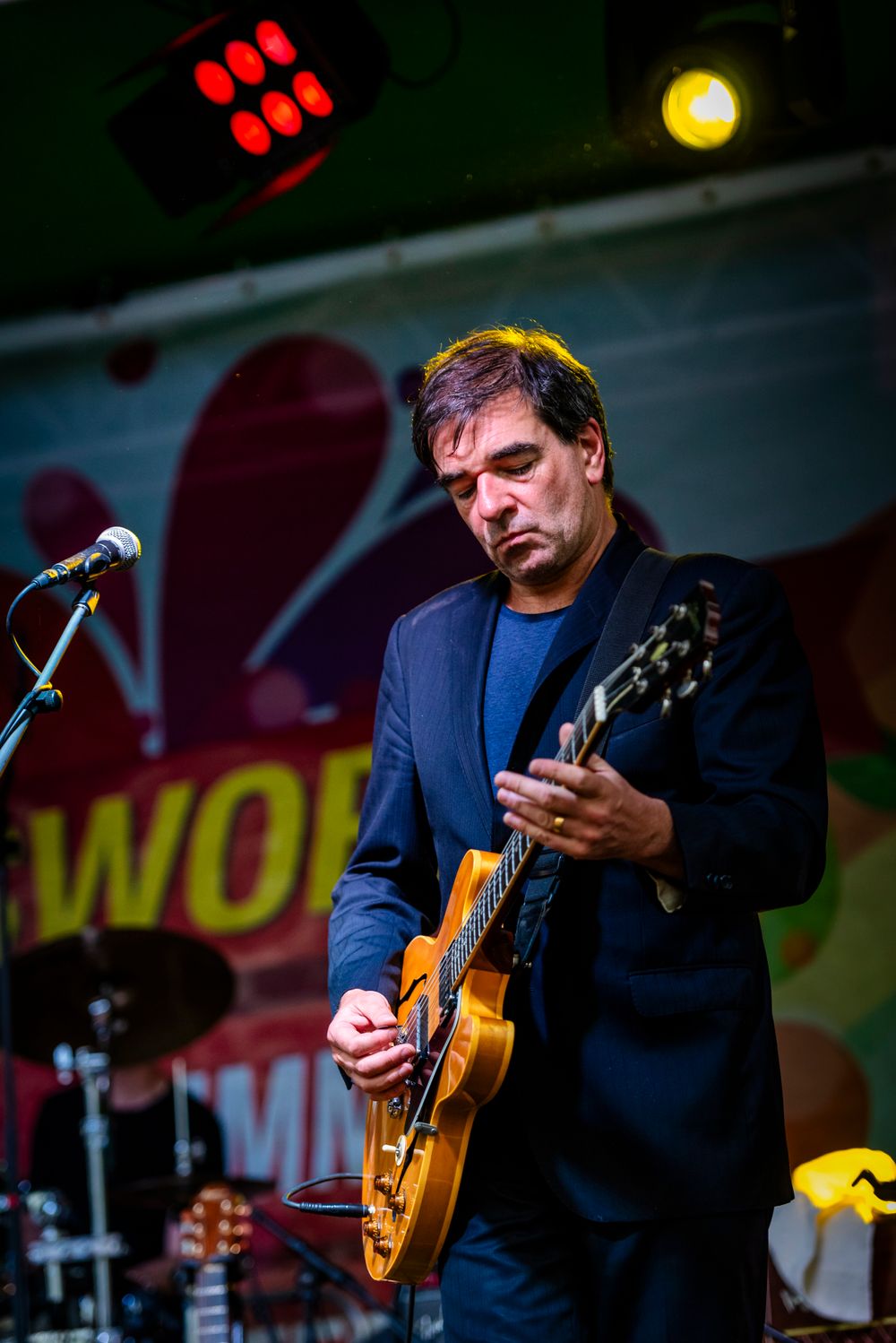 Fiachna Ó Braonáin, guitarist with the Hothouse Flowers performing in Swords Castle, Dublin.