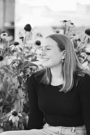 Black and white portrait among blooming echinacea flowers.