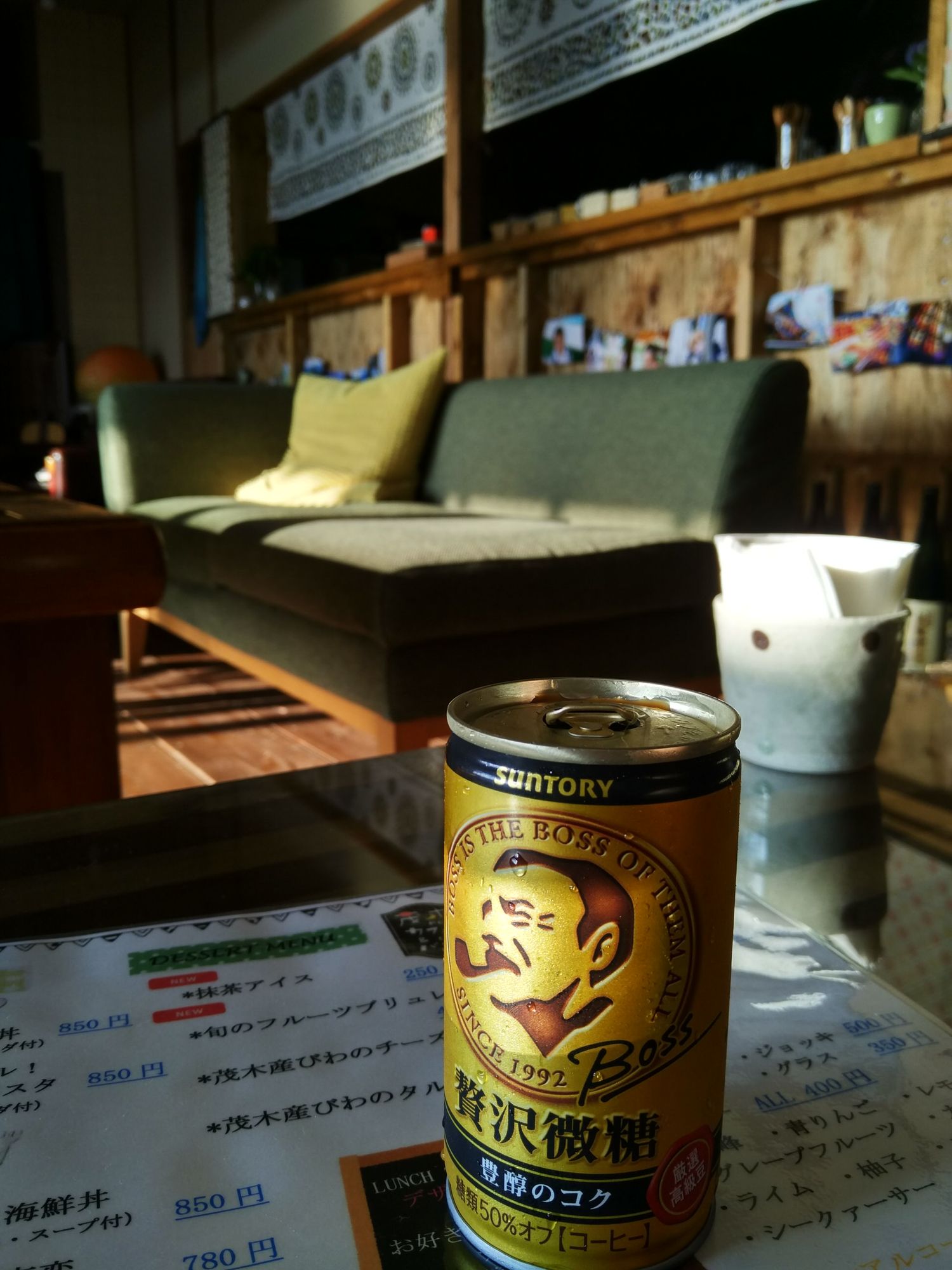 A can of Suntory Boss coffee sitting on the coffee table downstairs in the common room.