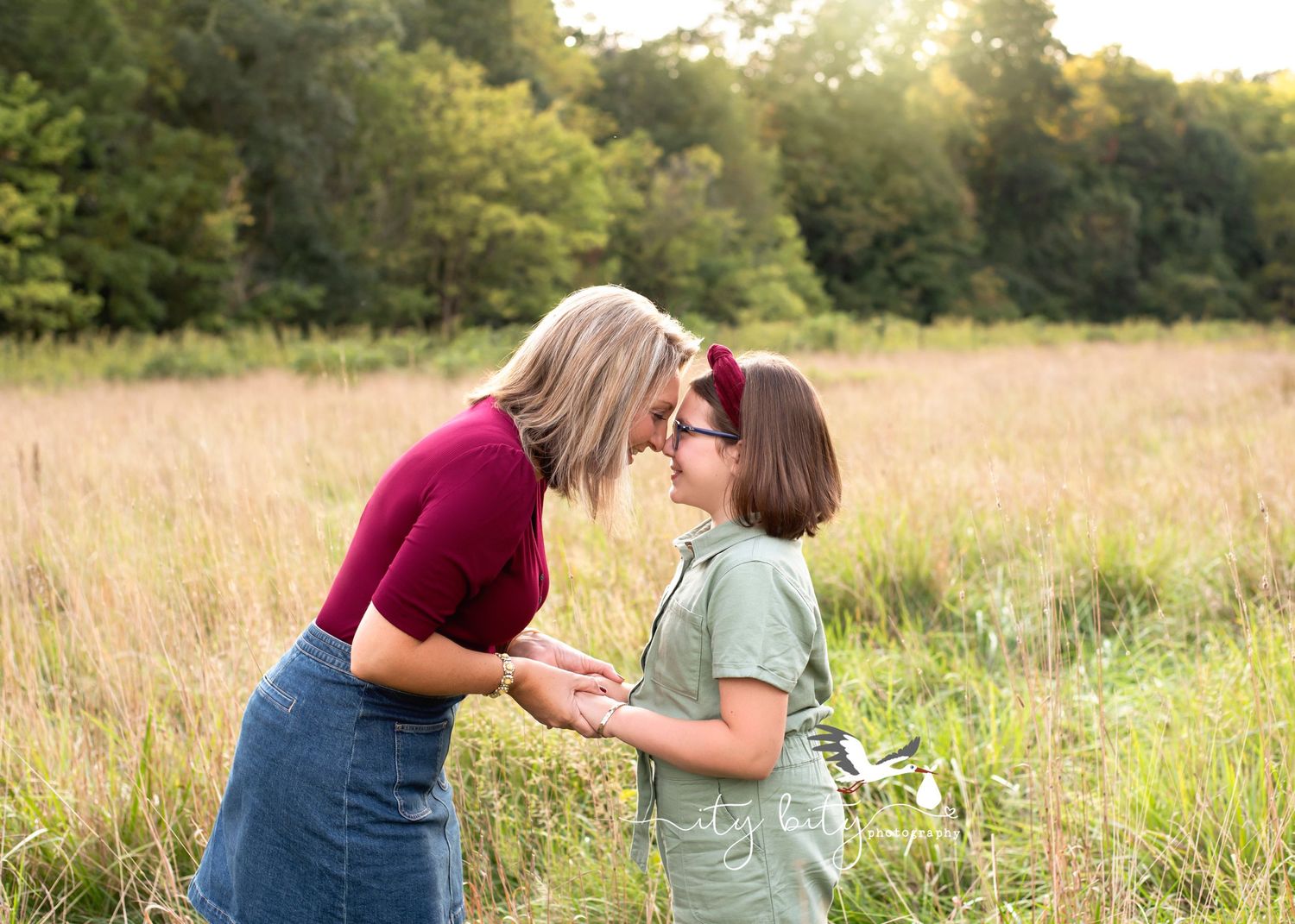 Mom and daughter nose to nose during outdoor sunset family mini session Avon Ohio