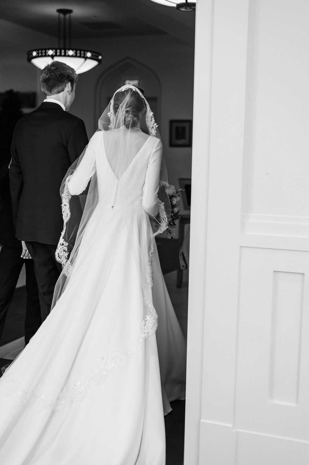 Husband and wife during their wedding mass at St. Francis Xavier in Stillwater, Oklahoma.