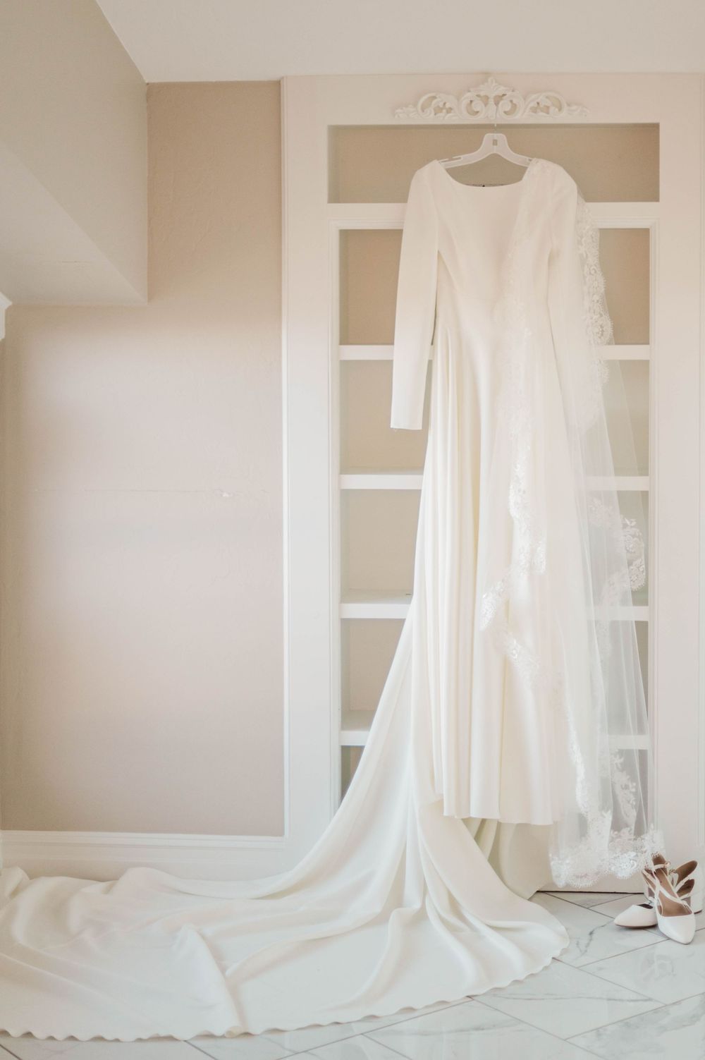 Bride gets ready at Meditations Event Center in Stillwater, Oklahoma ahead of her catholic wedding at St. Francis Xavier in Stillwater, OK.