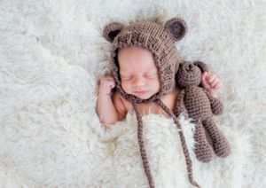 newborn boy pose natural light photography studio session teddy bear creative set memory captured Alabama Baldwin county sleeping crochet