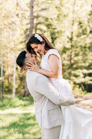 Romantic Tucson couples photo of a couple kissing in a bright forest setting with soft natural light.