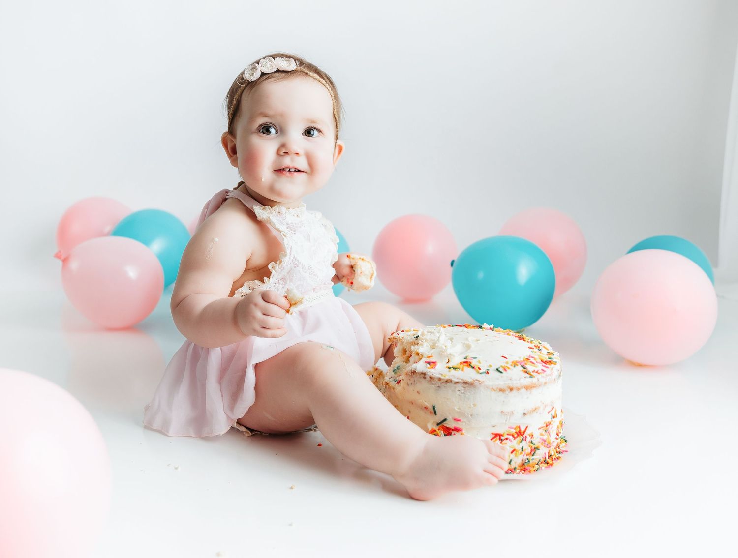 A smash the cake session of her enjoying cake. Greenville SC newborn photographer, Easley, SC newborn photographer, Upstate SC newborn