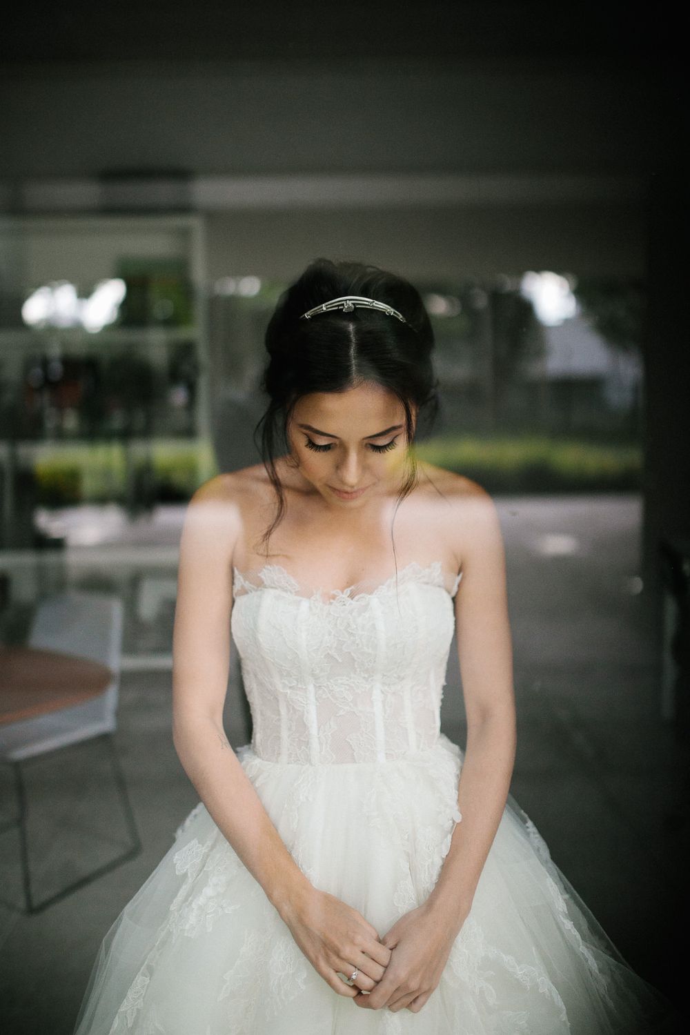 Romantic bridal portrait showing a classic strapless wedding gown with corset bodice.