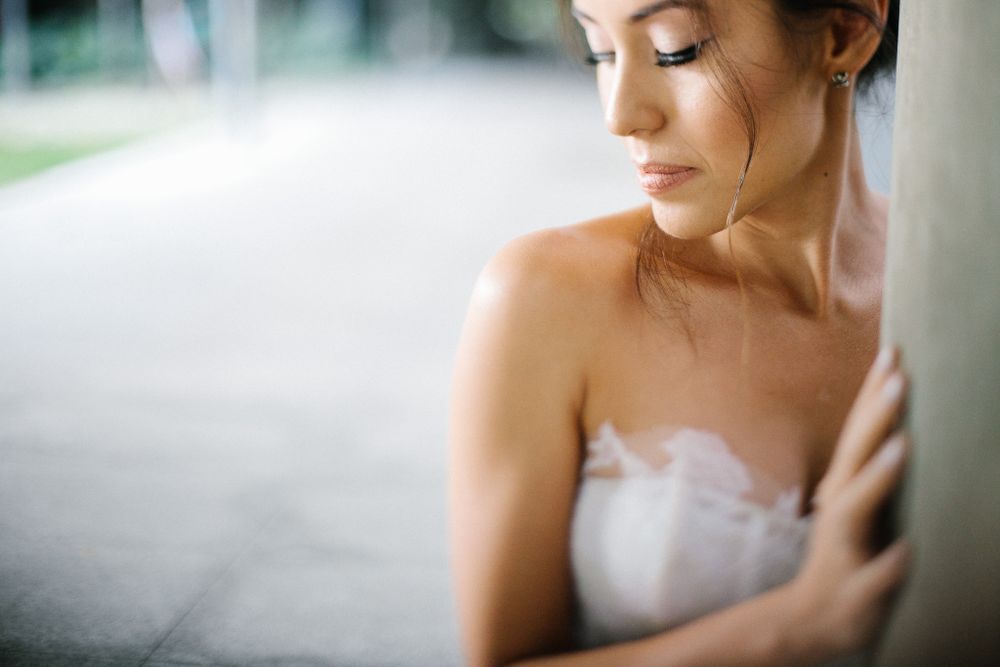 Soft, dreamy bridal portrait captured in natural light showing delicate lace details.