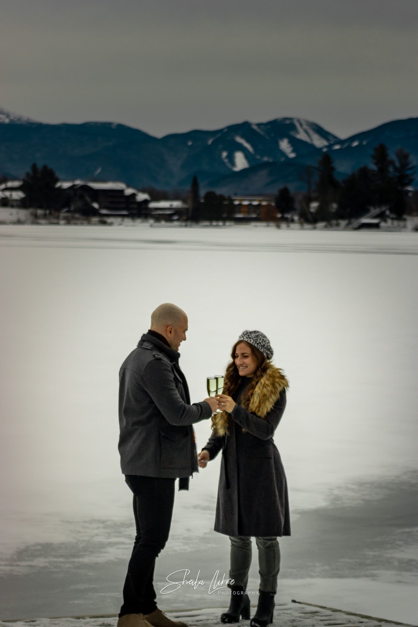 Surprise winter engagement in Mirror Lake Inn, Lake Placid New York.