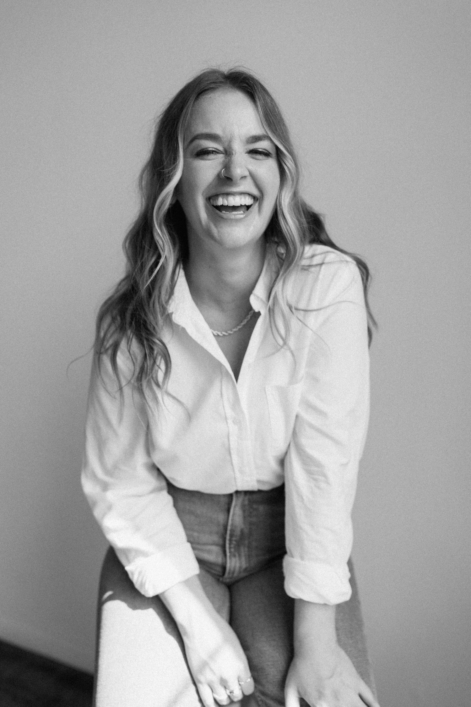 Erin Renee Photography smiling at camera in a studio photoshoot session