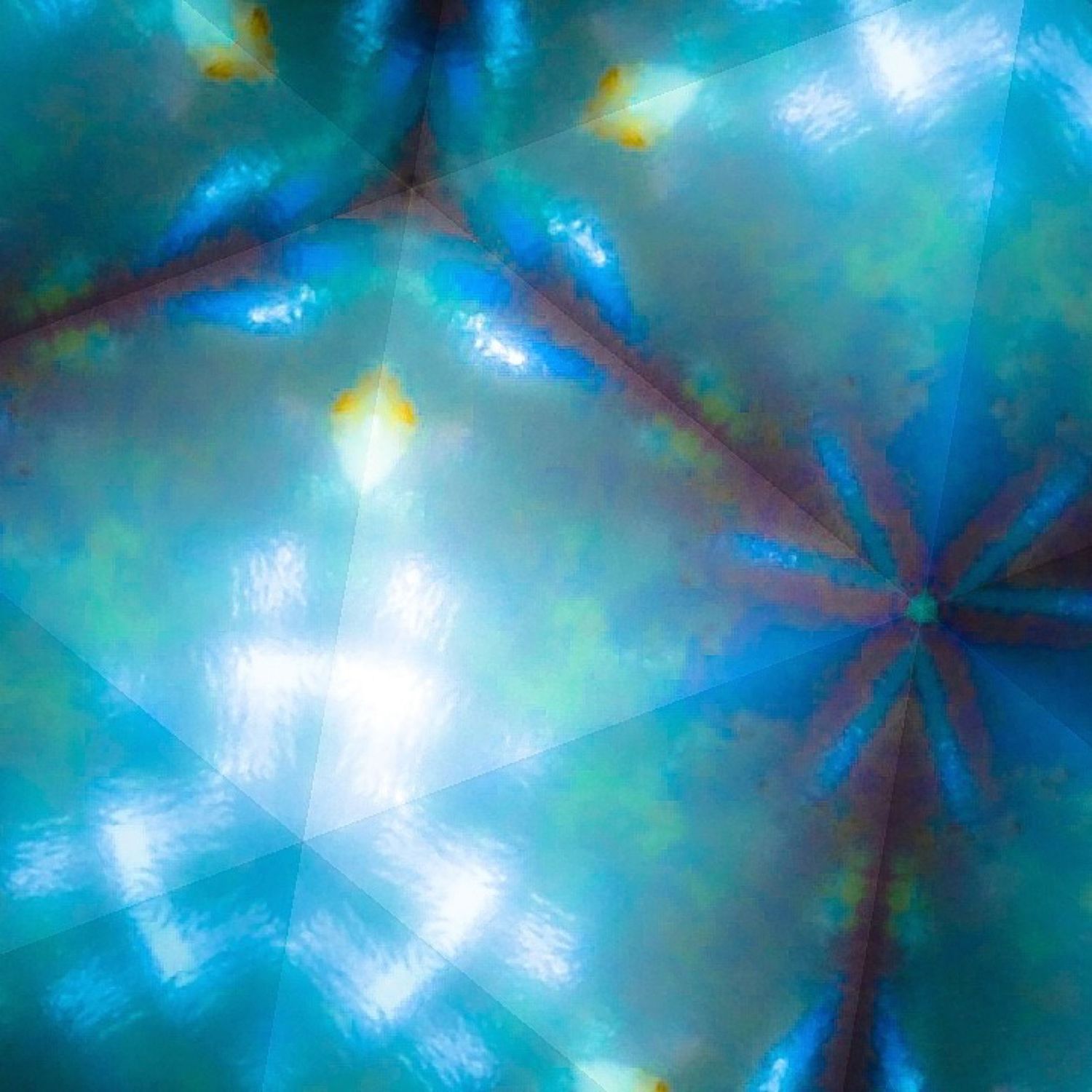 Kaleidoscopic image with radial pattern in turquoise and blue showing star-like formations.