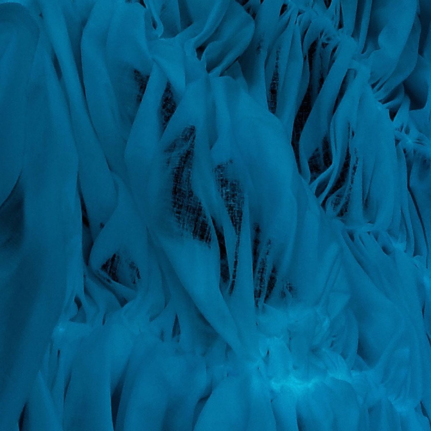Abstract blue textured surface with flowing vertical striations and shadowy patterns.