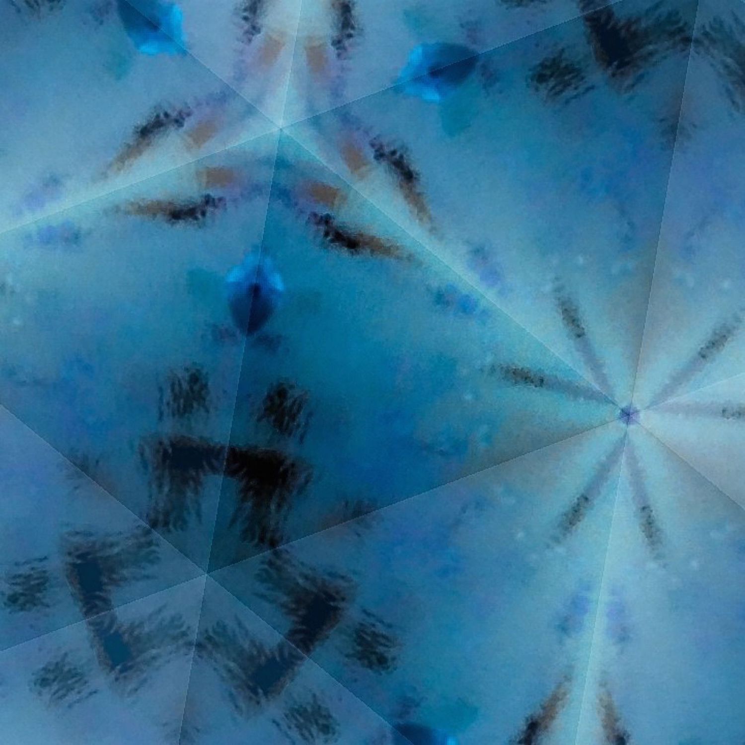 Radial abstract pattern in blue with dark streaks emanating from a central point.