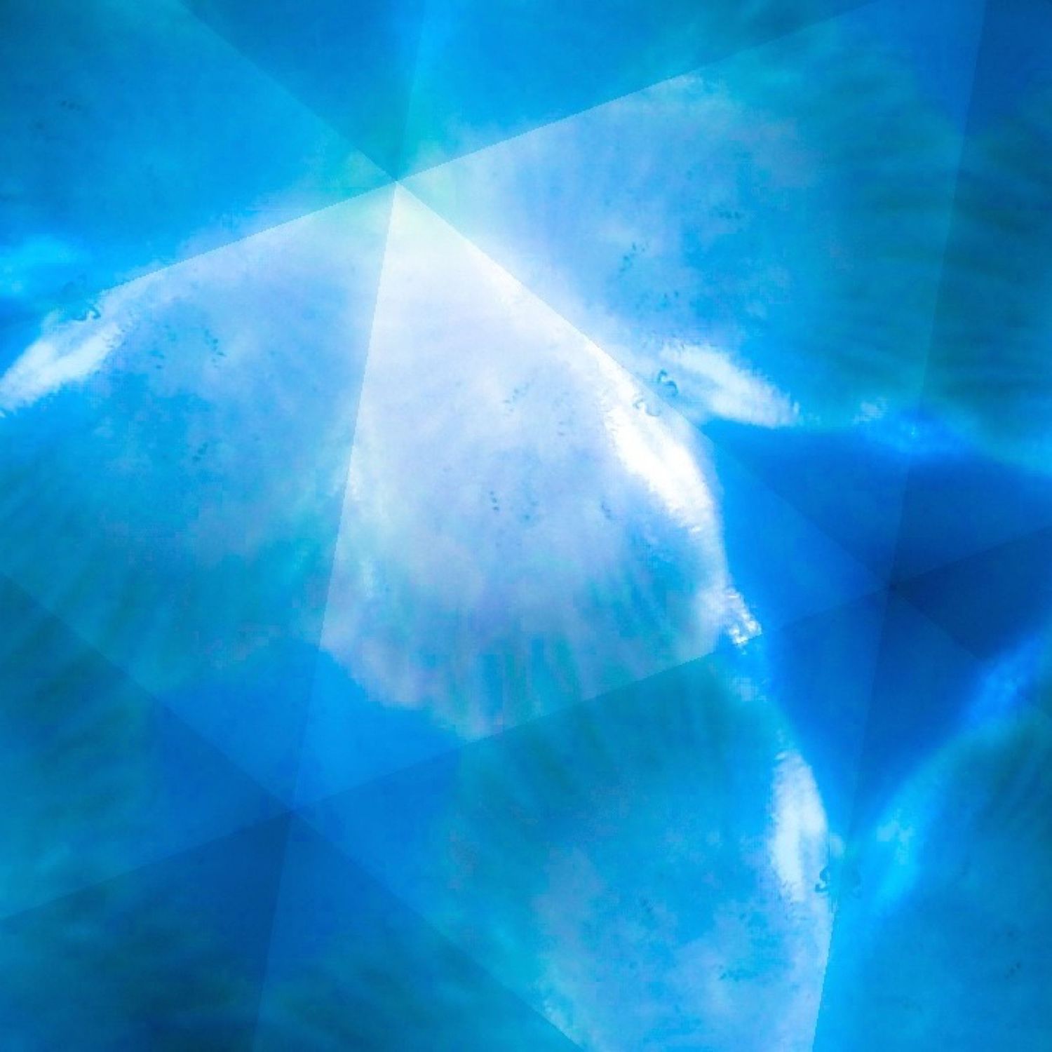Abstract light pattern in ethereal blue and white creating a crystalline geometric effect.