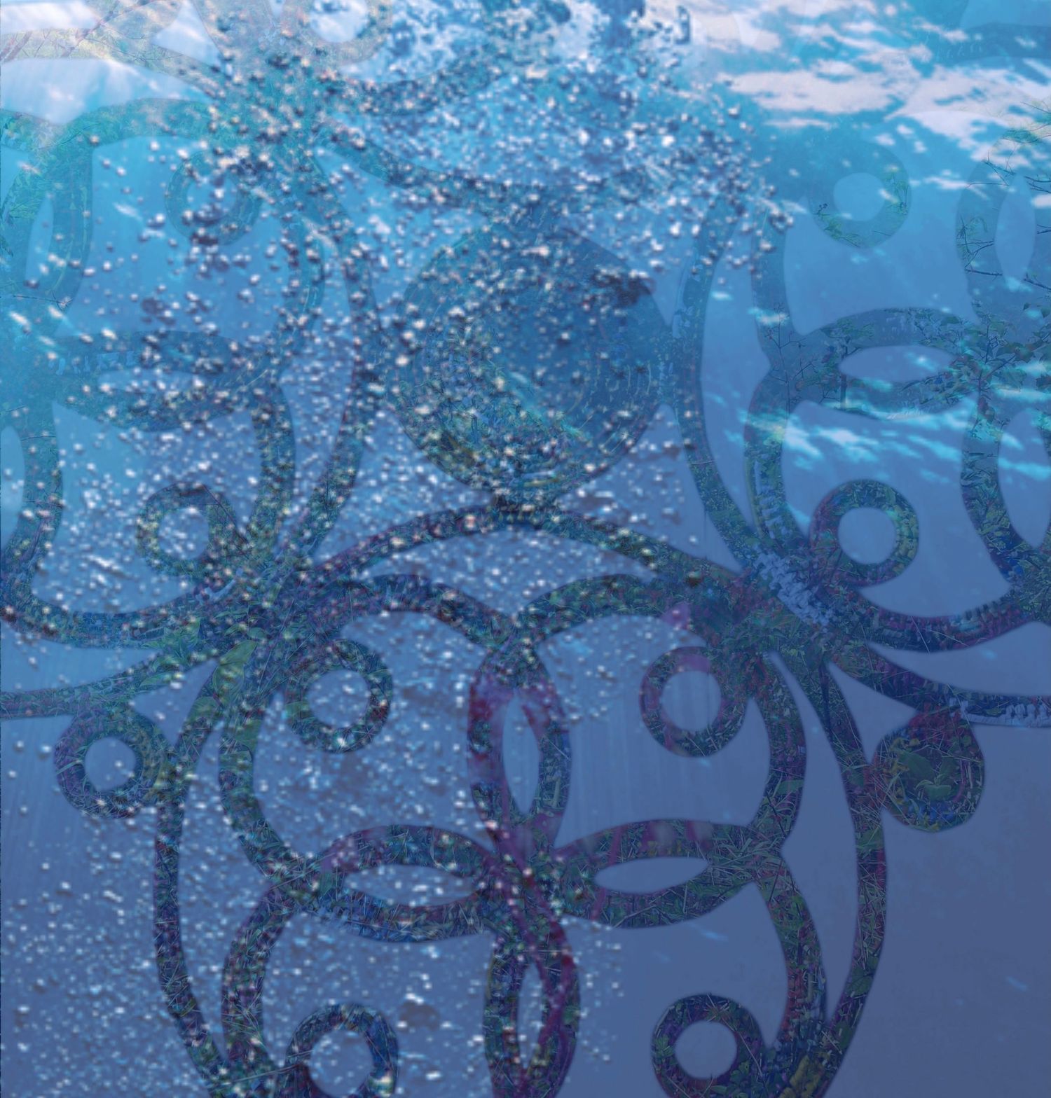 Underwater view of swirling decorative patterns with bubbles rising in blue water.