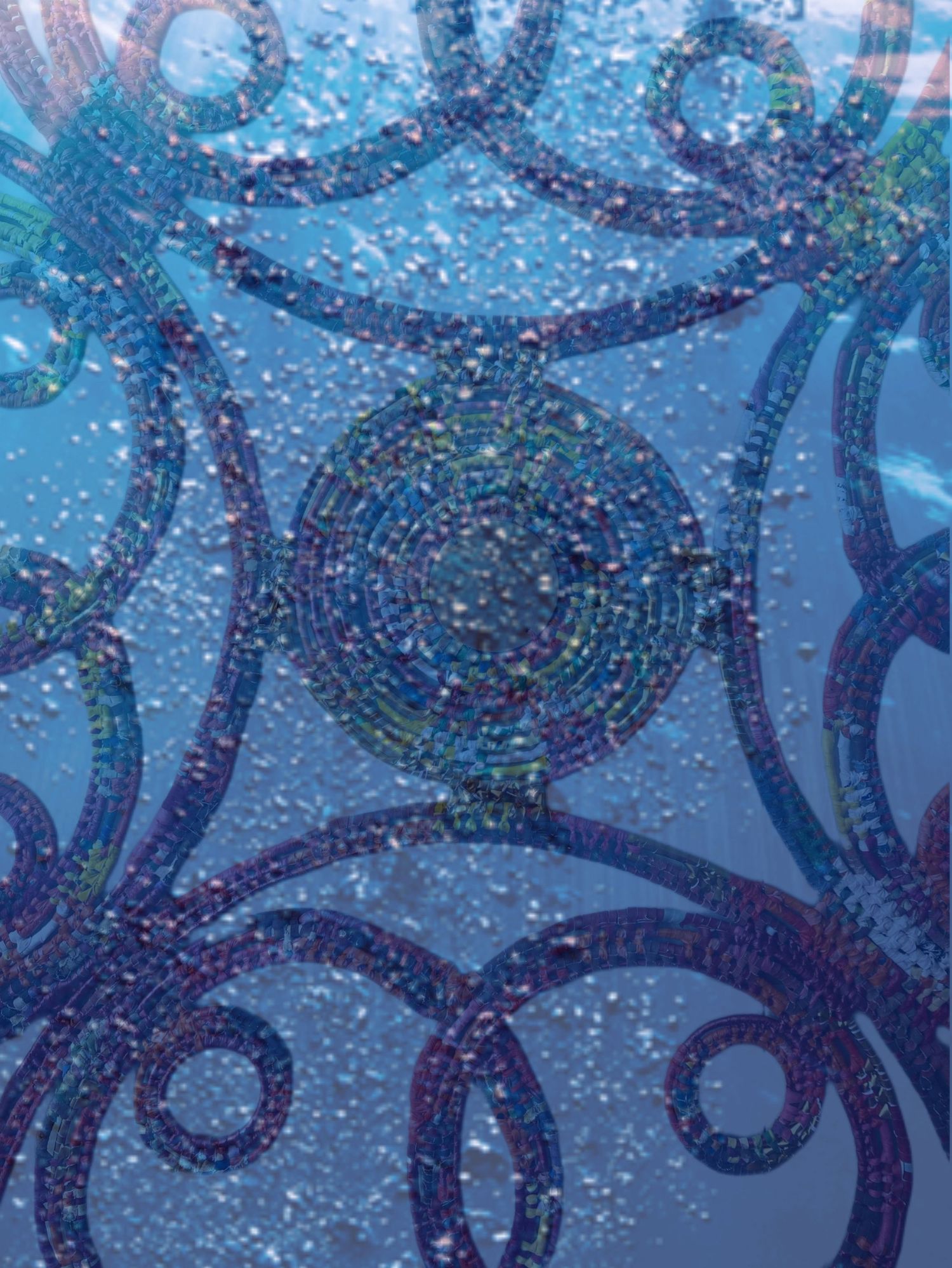 Abstract underwater photography showing circular patterns with bubbles in deep blue water.
