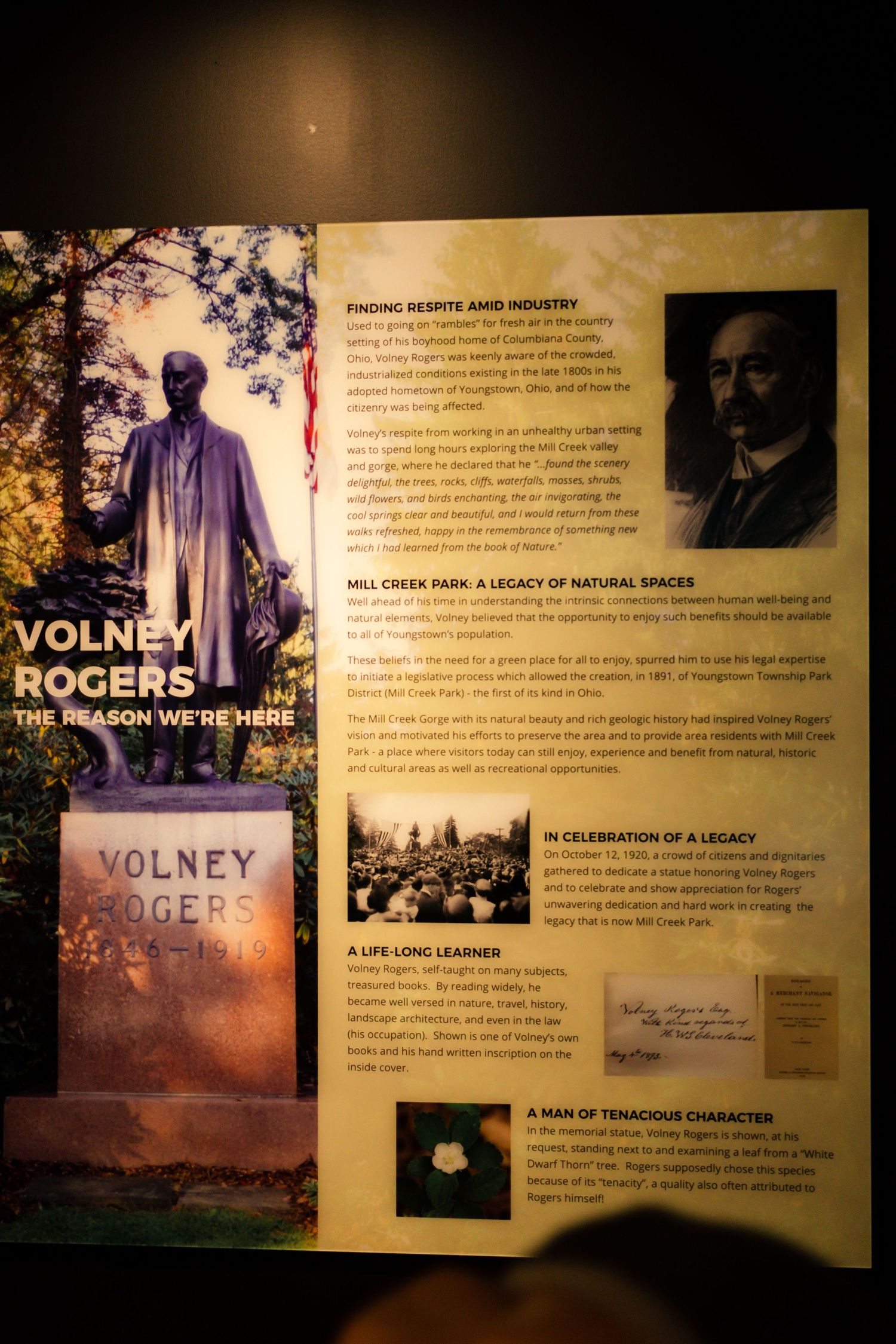 Historical exhibit panel showing Volney Rogers monument and biographical information.