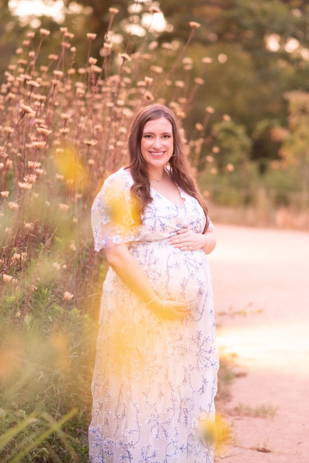 glowing mama. Expecting mother in flowing gown during boutique Houston maternity photography session at sunset
