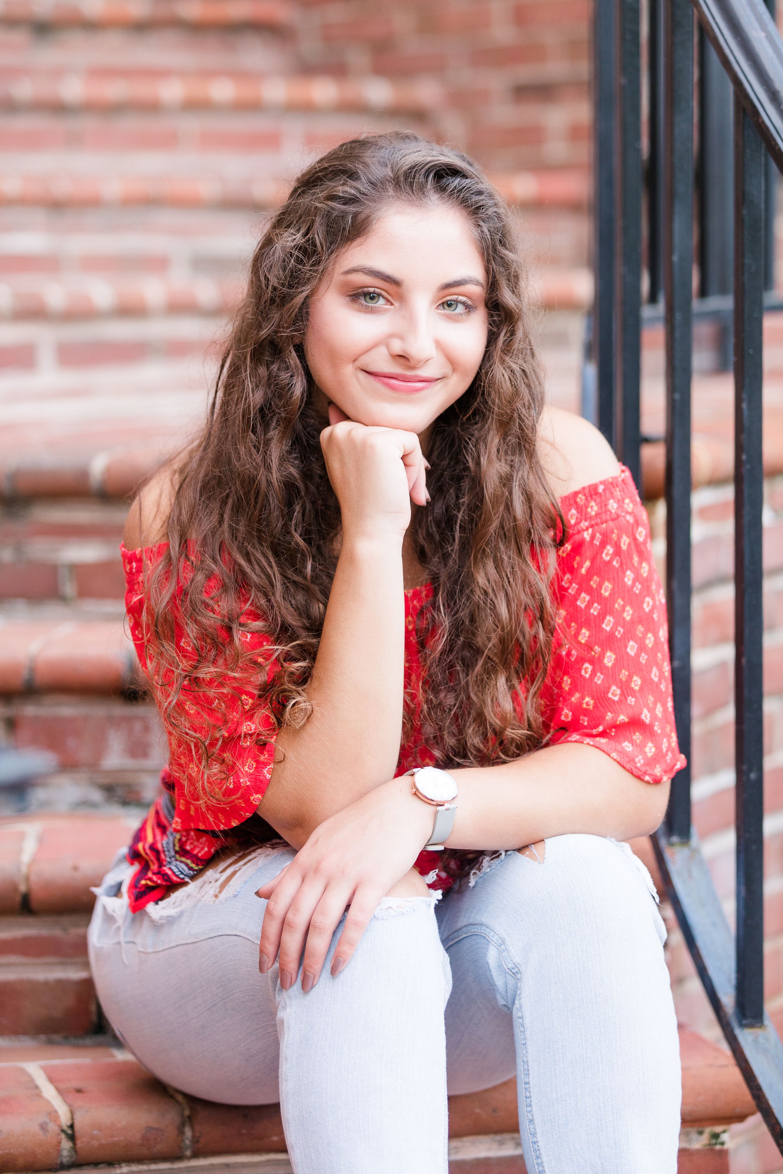 Senior girl posing on brick steps